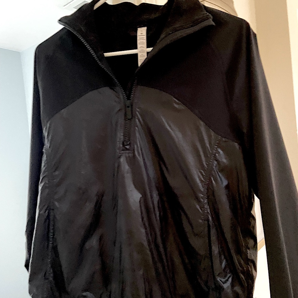 Lulu Lemon size 6 1/4 zip black athletic pull over. Looks brand new. Worn once.